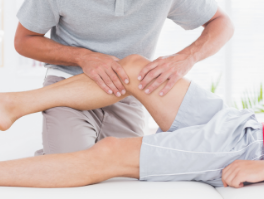 Physiotherapy treatment been carried out on a patients knee.